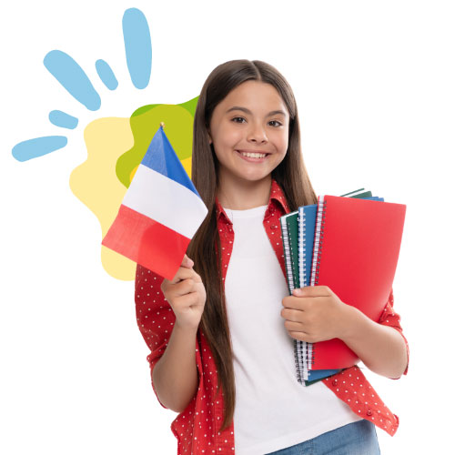 Girl with a French flag and note books happy to be taking French classes for kids in San Diego.