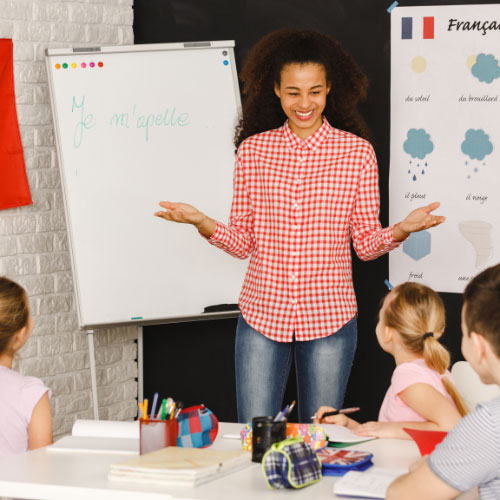 A French teacher in a classroom teaching students of French as a second language.